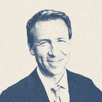 A portrait of a man in a suit and tie.